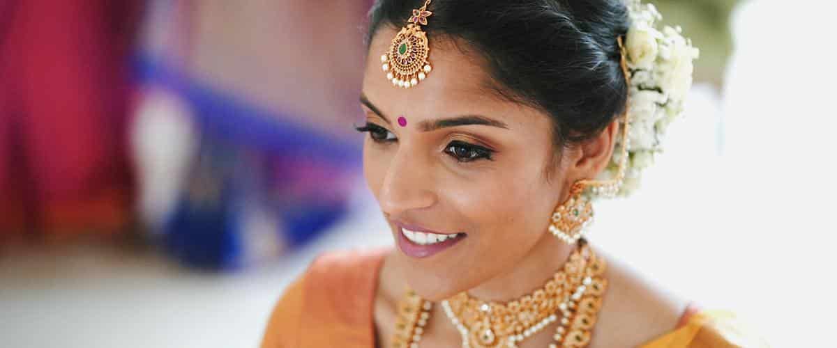 Tamil bride wearing jewelry on her wedding day
